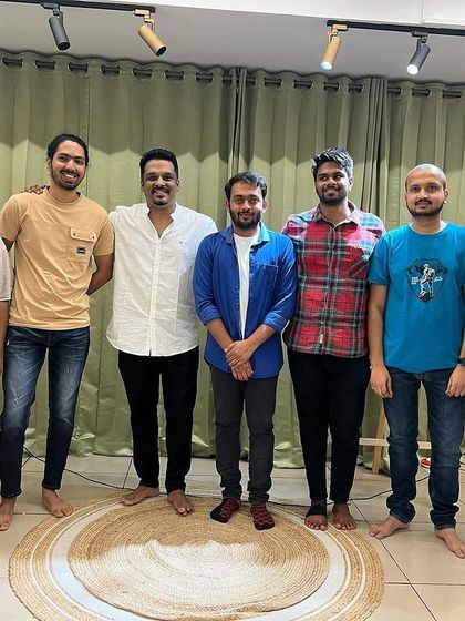 The performers from a house-full Kannada comedy show gather for a photo.