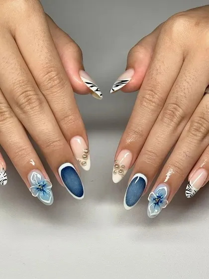 A sophisticated design featuring a deep blue cat-eye effect, translucent 3D flowers, and delicate pearl accents. This set perfectly balances modern trends with classic beauty.