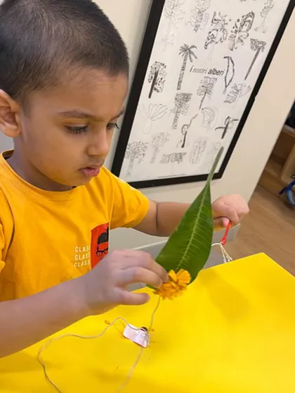 Stringing flowers and leaves with a needle and thread is a beautifully focused fine motor task. It requires concentration, hand-eye coordination, and dexterity, while also introducing early mathematical concepts like counting and patterning.