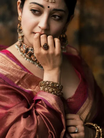 A detailed shot focusing on expression and accessories. This type of portrait allows me to highlight the craftsmanship of the jewelry and the subtle emotions of the subject, creating a rich, story-driven image that complements a full-length look.