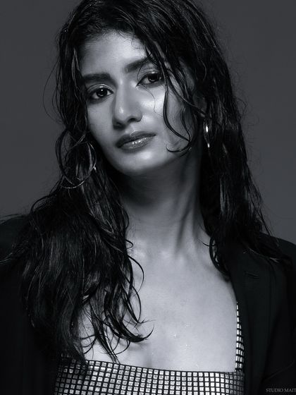 A black and white portrait from the "wet look" series, with a direct and confident gaze.