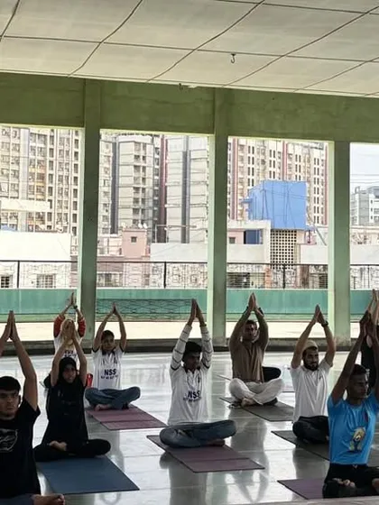 A view of a Yoga session held on a college rooftop. It was an uplifting experience, blending the practice of Yoga with the open sky and fresh air.