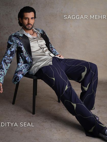 Aditya Seal on the cover of FHM India, embodying bold sophistication in our light blue printed tuxedo. The look is balanced with deep grey and white details for a modern twist on formalwear.