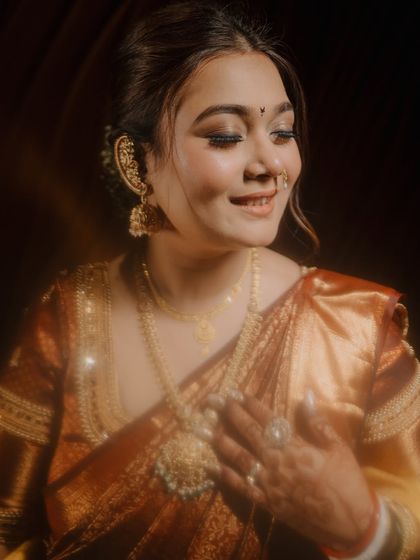 A soft and dreamy close-up of the bride, her eyes closed and a gentle smile playing on her lips. A truly artistic and emotional portrait.