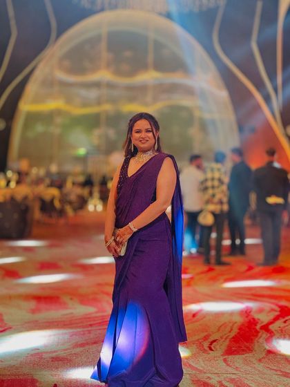 A long, flowing braid styled for a reception look. This hairstyle is perfect for dancing and keeps the hair neatly in place while still looking elegant.