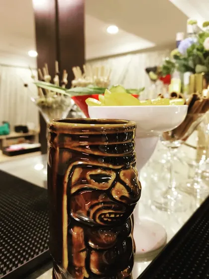 We offer a wide range of unique drinkware to match any theme, like this exotic tiki mug. It's perfect for serving tropical cocktails and adding a fun, island vibe to your party.