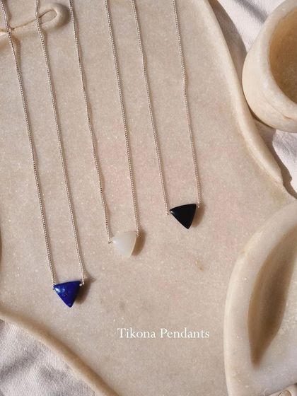 My Tikona pendants for men come in Black Onyx, White Moonstone, and Lapis Lazuli.