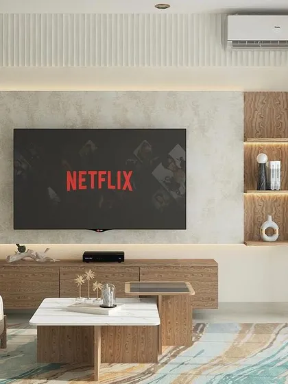 We designed this family lounge to be a perfect blend of style and function. The TV wall features a textured backdrop and integrated shelving, while the comfortable seating makes it an ideal spot for movie nights.