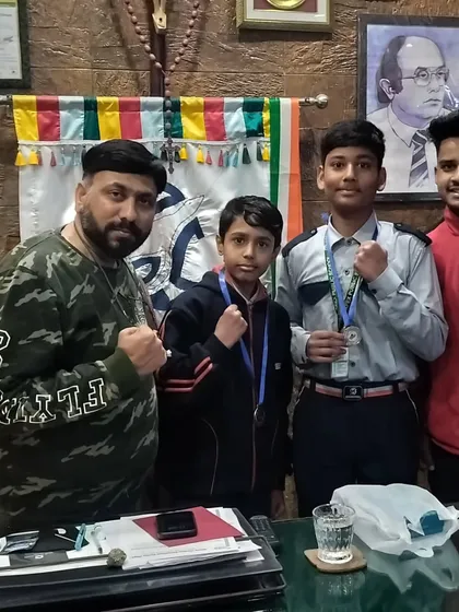 With my young medalists from the 1st DS Boxing League. I take pride in guiding students from school-level competitions to greater heights.