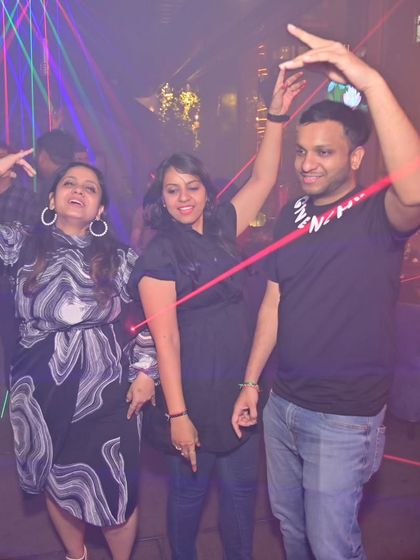 A fun group dancing under the laser lights at Gilly's. The energy was fantastic all night.