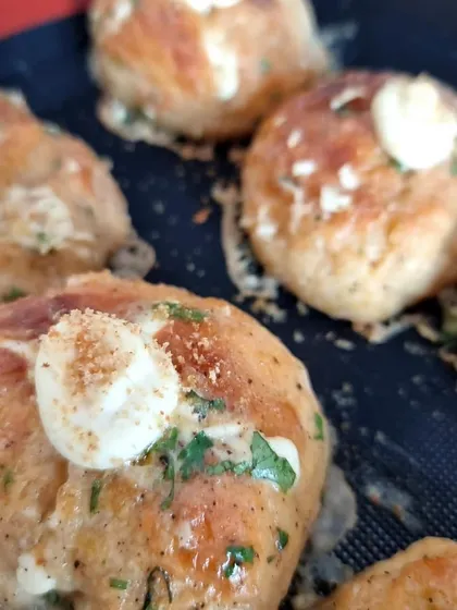 My Korean Cream Cheese Garlic Buns fresh out of the oven, topped with a dollop of cream cheese and herbs. These are often part of my weekend delight boxes and can be customized for special occasions.