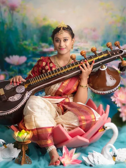 A full-length shot of our Saraswati theme, showing the beautiful details of the veena, the lotus, and the traditional attire.