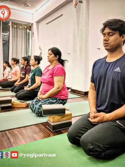 Our classes are a holistic practice for the mind and body. Here, our students are in a state of Dhyana (meditation), finding stillness and focus after an active asana session.