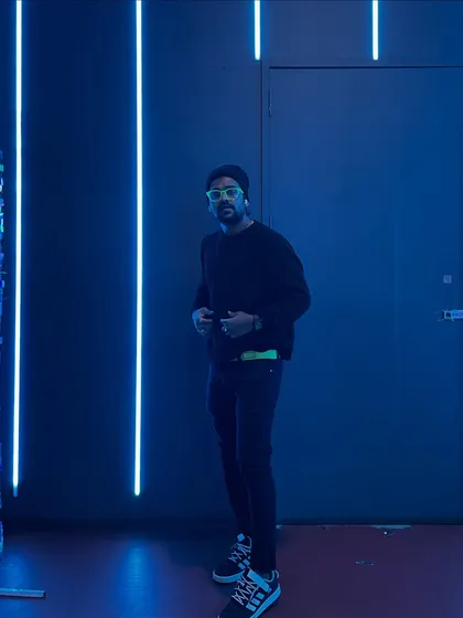 A full shot in the neon room, blending style with the atmosphere of a modern club.