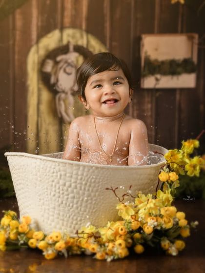 Giggles and splashes make for the most memorable photos in this fun and interactive tub time session.