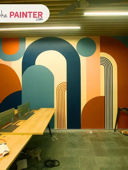 Your office doesn't have to be boring. We create inspiring workspaces with custom wall art, like this vibrant boho-style mural, designed to boost creativity and make your commercial space stand out.