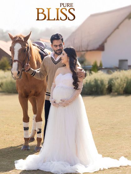 A fairytale maternity portrait. This stunning outdoor session with a gentle horse and a flowing white gown created a truly magical memory for the parents-to-be.