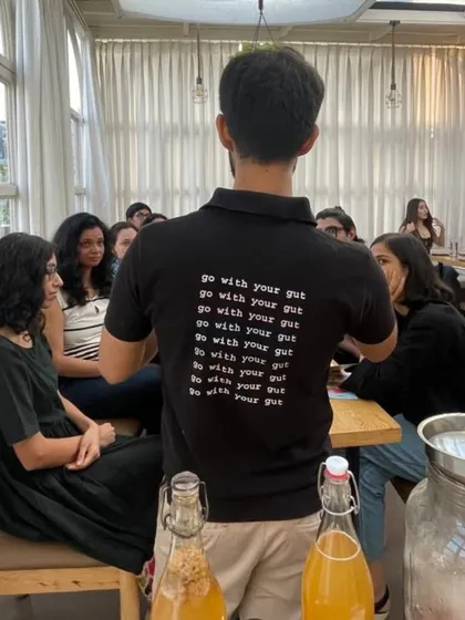 A look inside our kombucha brewing workshop, where curiosity and gut health meet. Our instructor, wearing his "go with your gut" motto, guides a group through the art of fermentation.