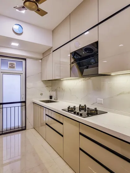 Another angle of the cooking area, highlighting the sleek black appliances.