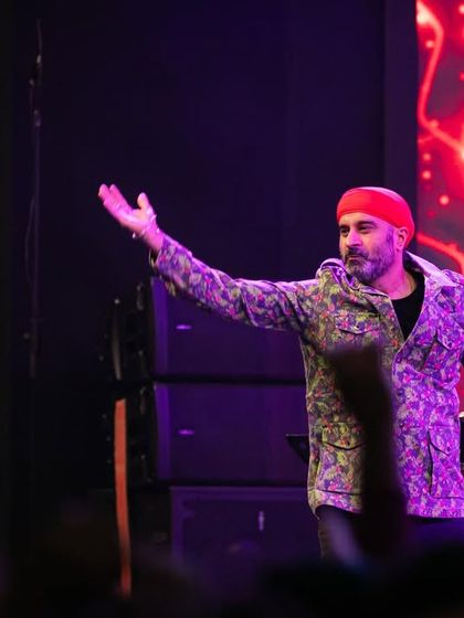 A candid shot of me on stage, interacting with the audience during the Ganesh Utsava.