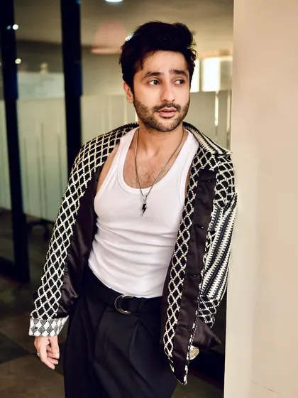 A more candid, relaxed shot of Harsh Beniwal. This style of portraiture helps in showing a more personal side of a public figure.