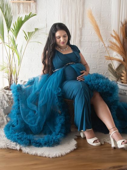 A relaxed and confident pose in our lifestyle corner. The combination of the elegant gown and the casual, cozy boho decor works beautifully together.