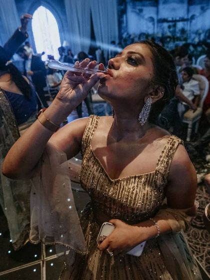 A guest enjoys a unique test tube shot on the dance floor. We provide a variety of fun and unconventional ways for your guests to enjoy their drinks.