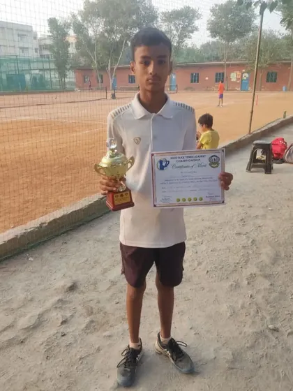Mukul, the winner of the Under-14 category, with his trophy and certificate. His hard work in training sessions is clearly paying off.