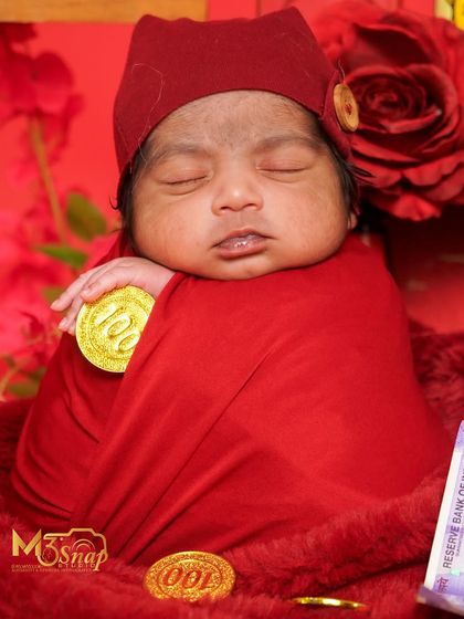This little one is holding a chocolate coin. The details make the theme complete.