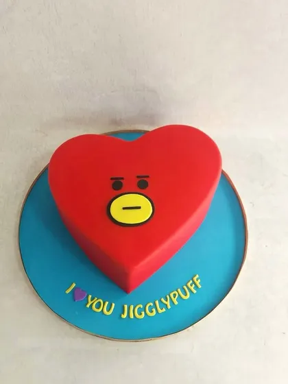 A simple but very cute heart-shaped cake, inspired by the BT21 character Tata. Perfect for a K-pop fan.