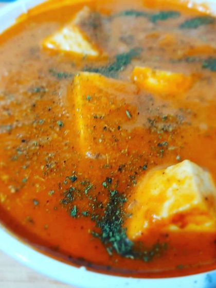 A close-up view of the rich, smooth gravy of our special Paneer Makhan Maarke.