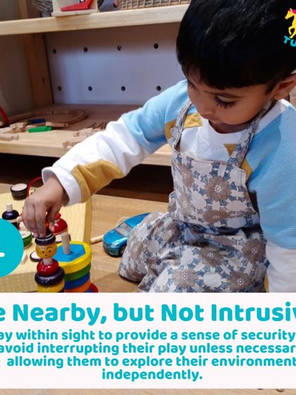 A young child playing independently with a stacking toy. I design the space so children feel secure enough to explore on their own.