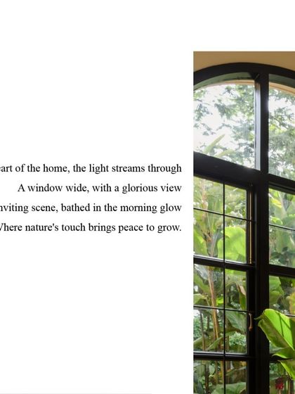 In the heart of the home, light streams through a wide window with a glorious view. This is where nature's touch brings peace and growth, connecting the indoor space with the world outside.