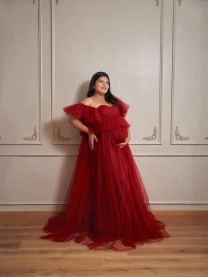 A full-length portrait in our Lorna gown. This dress provides a stunning silhouette against the simple, elegant backdrop of our studio.