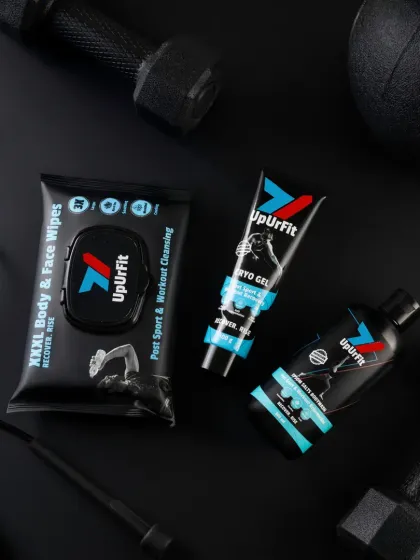 A dark and moody flatlay for a fitness brand. We used a textured black background and arranged the products with gym equipment like dumbbells and jump ropes to create a high-performance feel. The lighting is focused to highlight the product textures and bold branding.
