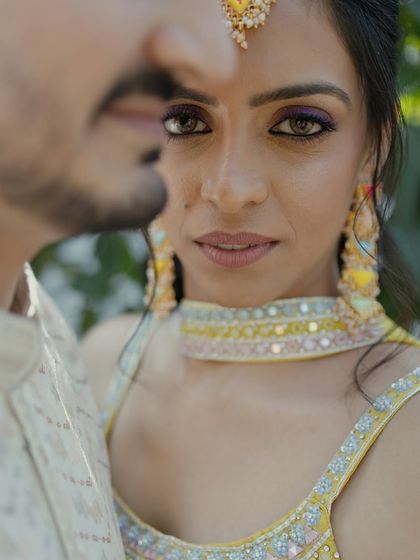 An intense and captivating close-up portrait of the bride. The focus on her eyes creates a powerful and emotional connection with the viewer.