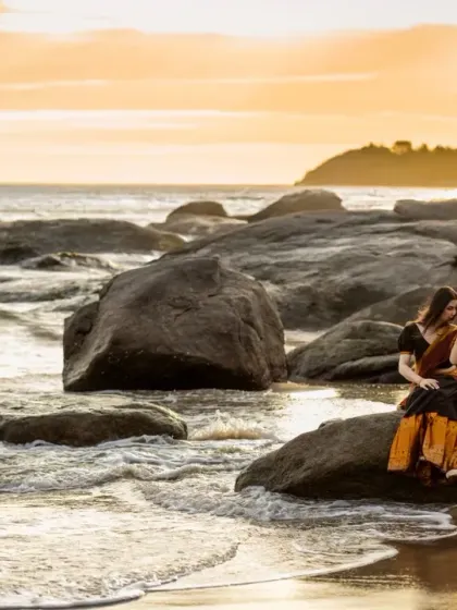 For pre-wedding and destination shoots, I love using epic landscapes to tell your story. This sunset shot at Kapu Beach near Mangalore uses the golden hour light and the dramatic coastline to create a breathtaking, romantic photograph.