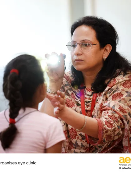Service in action. Here, a volunteer ophthalmologist provides a free vision screening during an eye clinic organized by our student-led 'Make A Difference' club. We empower our students to identify community needs and take meaningful steps to create a positive impact.