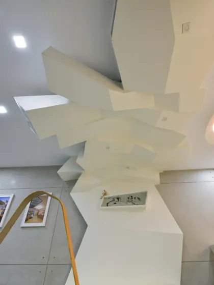 A detail of the abstract, geometric ceiling and wall structure in my studio. This sculptural element blurs the line between architecture and art, reflecting our firm's philosophy of creating expressive and functional spaces.