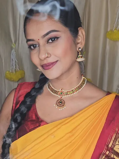 Another festive look for a Diwali photoshoot. The makeup is traditional and vibrant, perfect for celebrating the festival of lights.