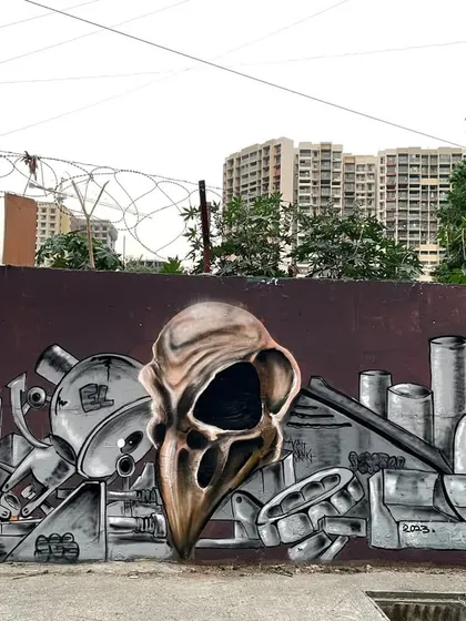 This 'AFTER LIFE' graffiti piece shows my roots in street art. It combines a goth aesthetic with mechanical lettering, creating a raw, industrial vibe right on the street.