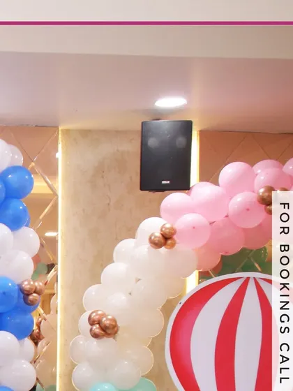 A close-up of our balloon arch decorations. The combination of pink, white, and blue balloons with small metallic accents shows the detail and care we put into our decor.