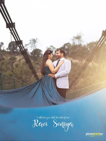 A dramatic pre-wedding photo on a bridge, using the bride's flowing gown to add movement and elegance to the composition.