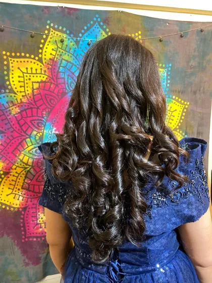 A back view of these perfectly formed soft curls. This style adds so much volume and glamour to the hair.