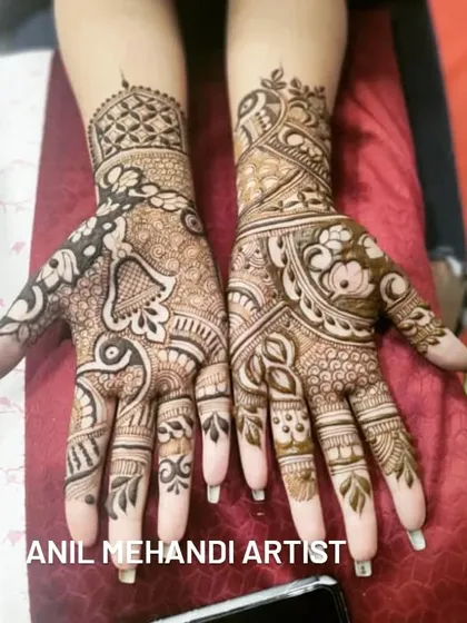 A classic design featuring bell (jhumka) and peacock motifs. The intricate patterns cover the entire palm and extend up the wrist, perfect for any festive occasion.