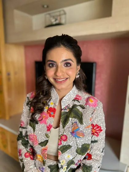 A bright and fresh look for this client in a floral jacket. The makeup is kept clean with a pop of pink on the eyes to match the outfit.