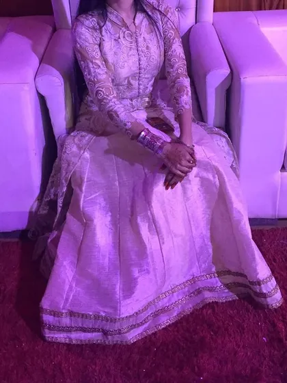 Another view of the ivory fusion jacket set, showing how the outfit looks while seated. It remains elegant and comfortable throughout any event.