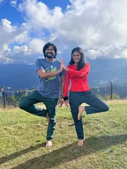 Practicing Vrikshasana (tree pose) with a friend against the backdrop of the Nepal mountains. Yoga is a beautiful practice to share, creating stability and connection.