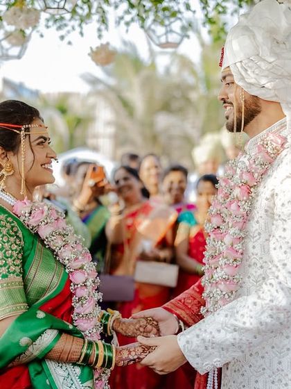 The moment they officially become husband and wife, holding hands and smiling at each other.
