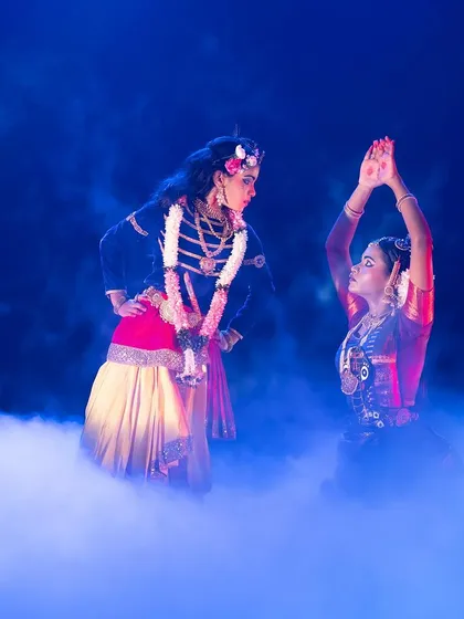 A scene filled with emotion and drama from "KRISHNA". The use of stage fog and focused lighting creates an intense and captivating atmosphere for the audience.